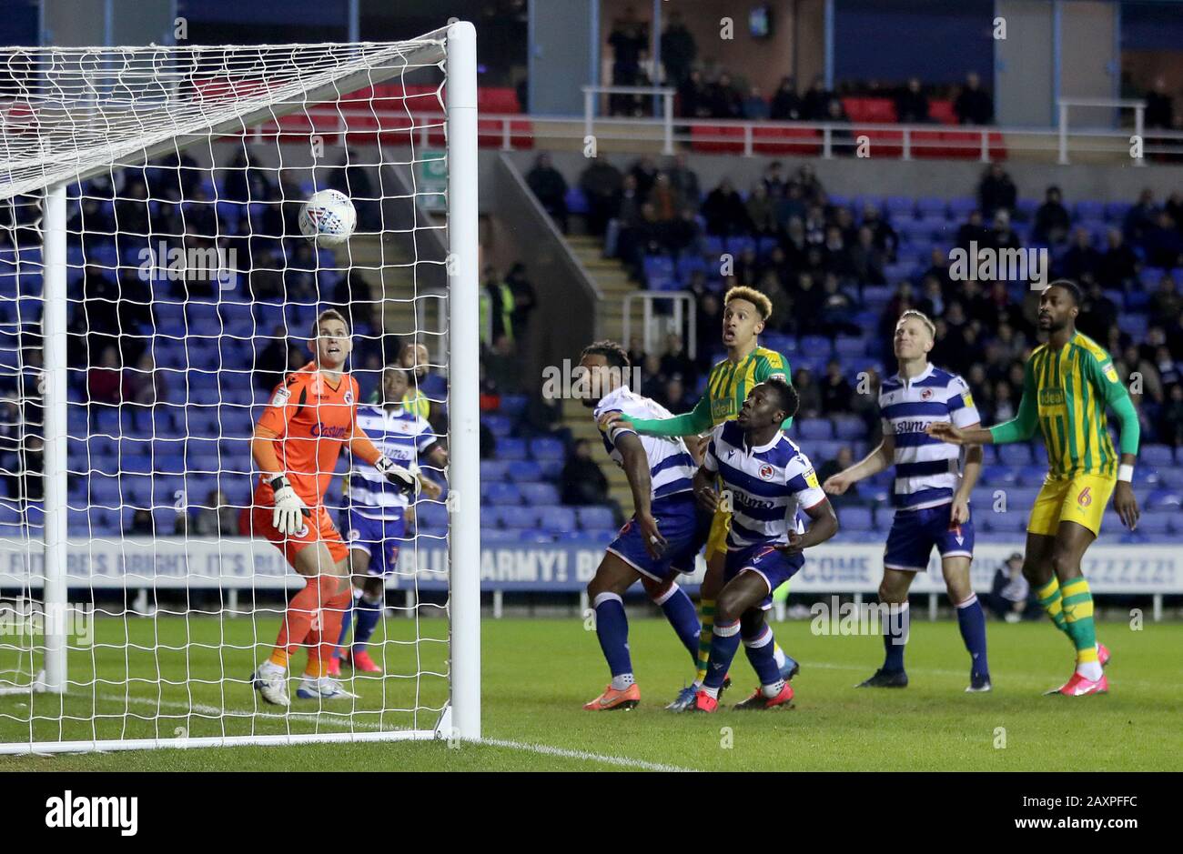 Players from both sides watch the flight of the ball as West Bromwich Albion's Kyle Bartley (hidden) scores his side's second goal of the game during the Sky Bet Championship match at the Madejski Stadium, Reading. Stock Photo