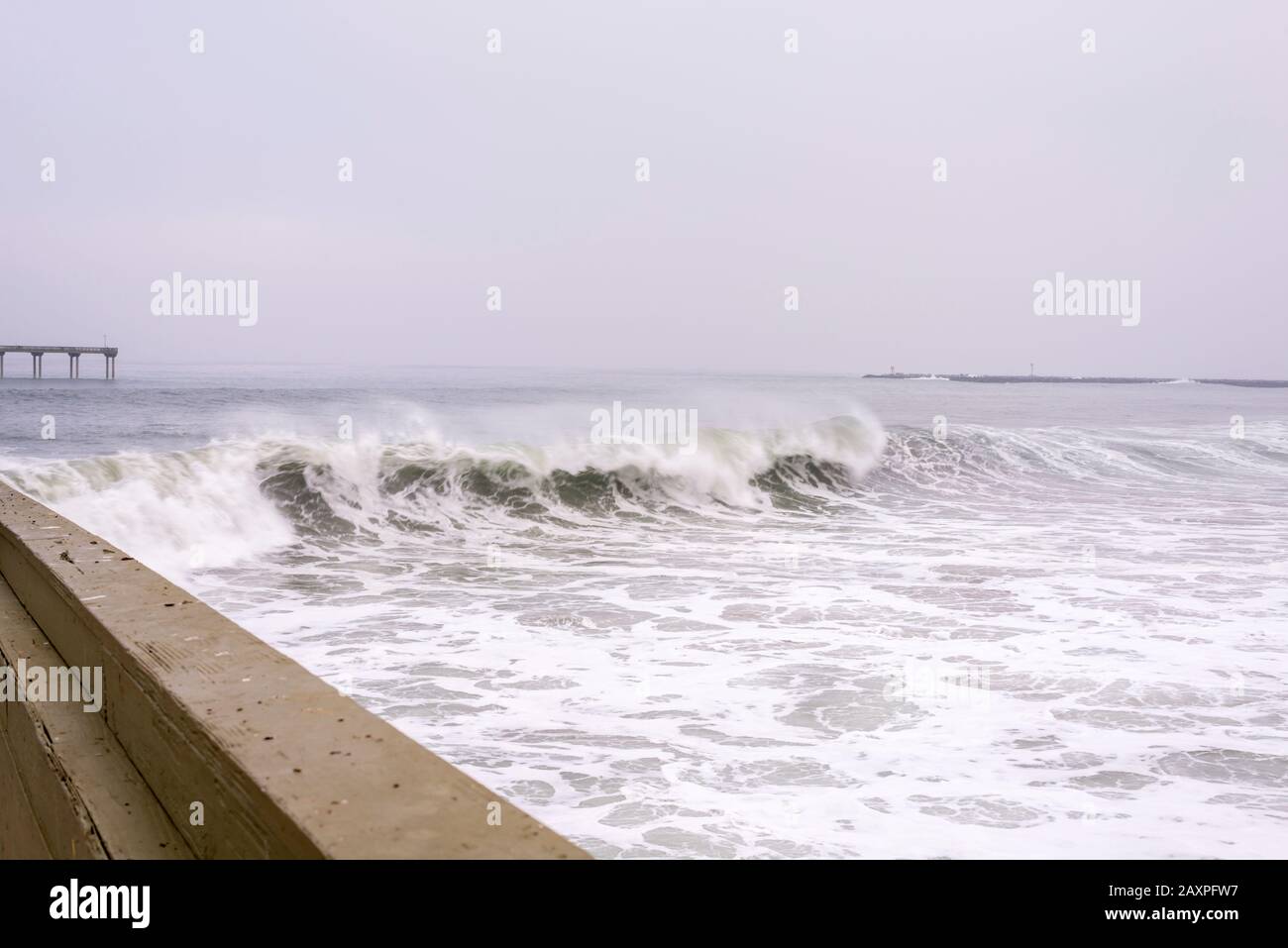 Big winter surf viewed from on the Ocean Beach Pier. San Diego, CA, USA