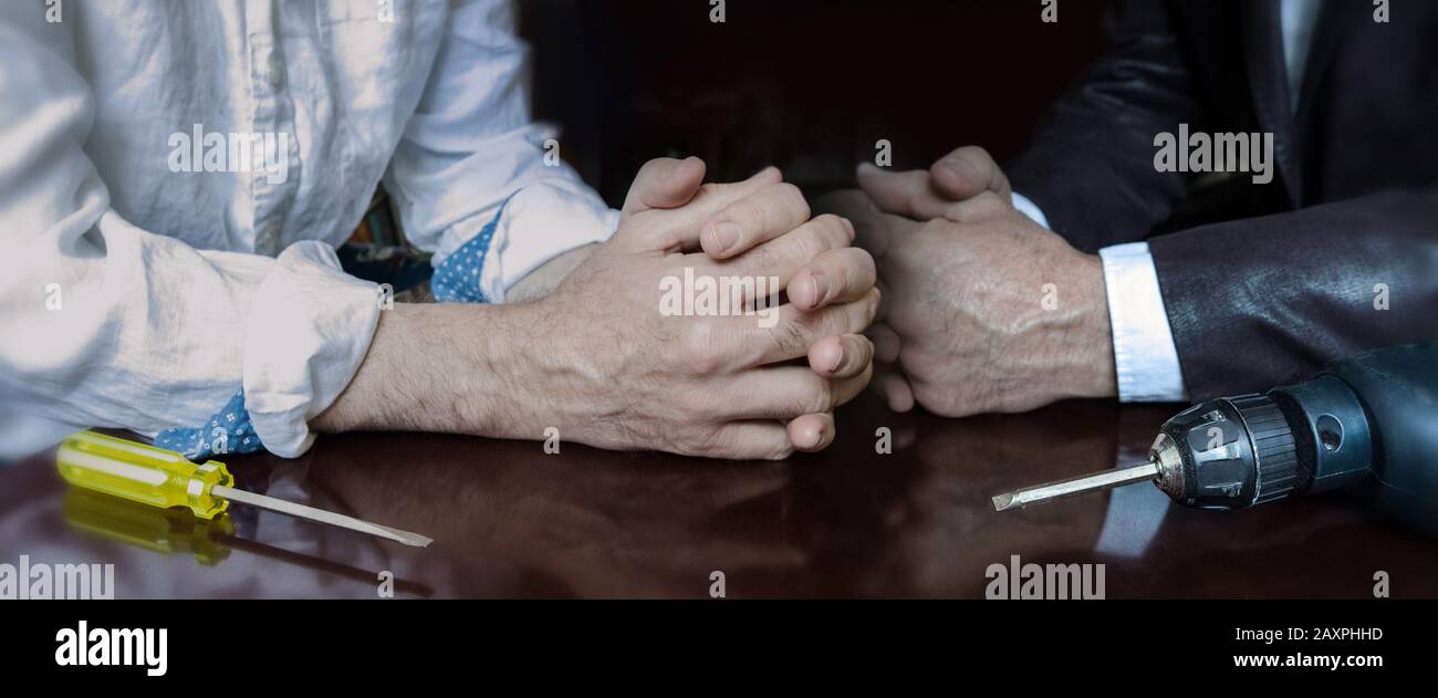 Two men, face to face, one is in a position of strength with more