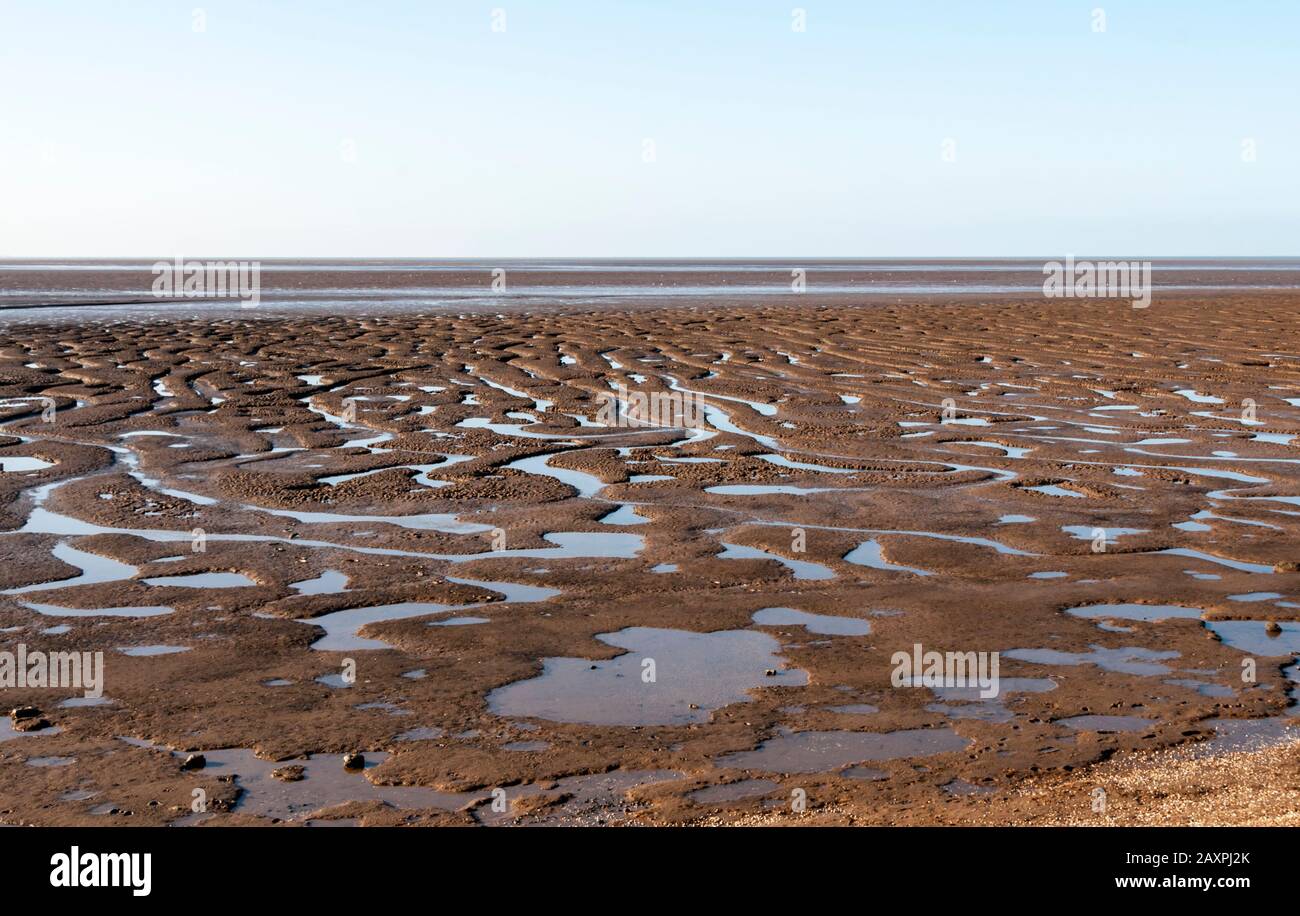 Mud in The Wash during low tide at Snettisham, Norfolk. Stock Photo