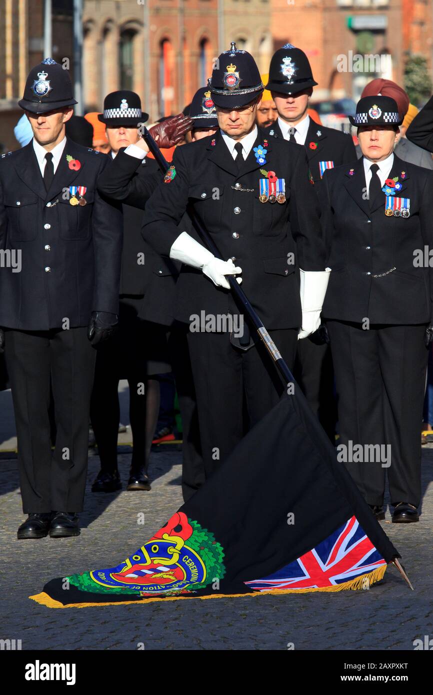 British policie officers commemorating the soldiers that died during World War I outside the Menin Gate in Ypres, Belgium Stock Photo