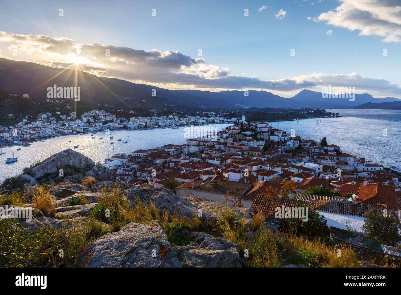 View of the Chora village of Poros island and Galatas village in Peloponnese, Greece. Stock Photo