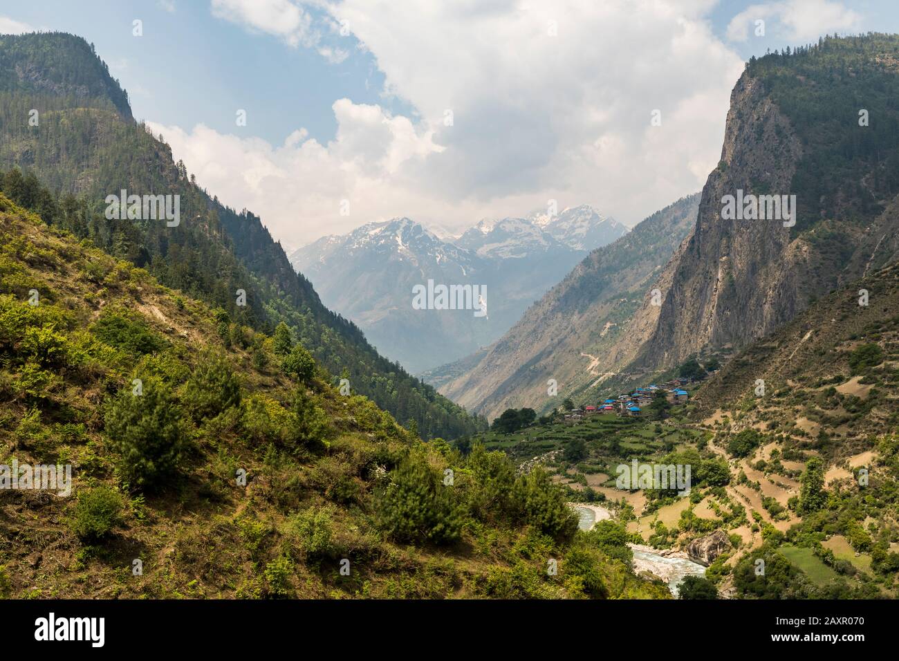 Landscape of deep river valley and village in the mountains of Nepal