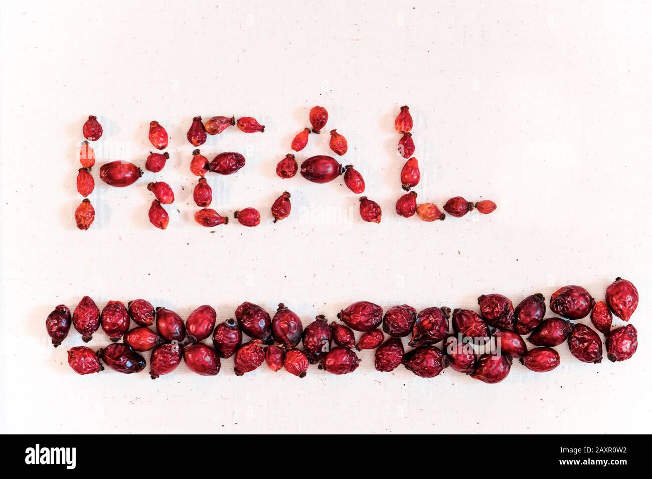 Dried red rose hips (berry, fruit) on white background did word heal Stock Photo