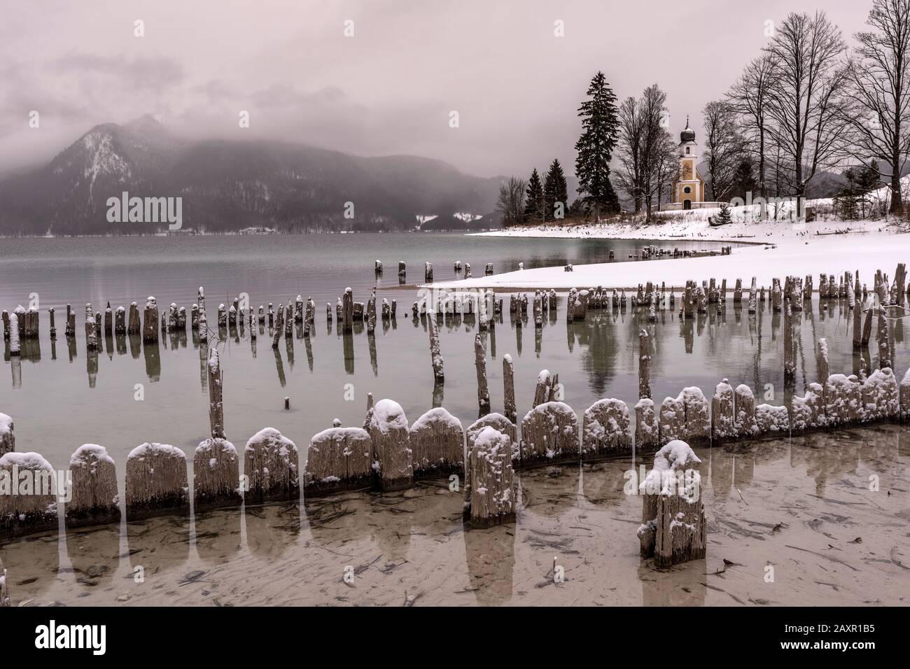 On the Zwergern peninsula on the winter shore of the lake Walchensee in the Bavarian Prealps Stock Photo