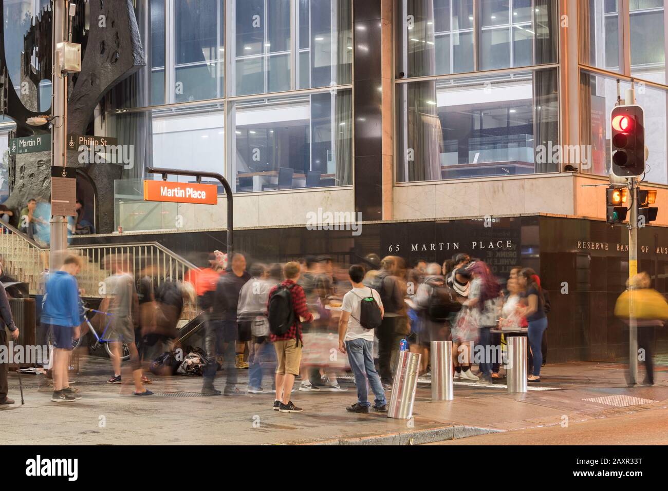 Sydney Aust. Feb 12, 2020: Homeless people cue up at night for free pizza and drink served by volunteers near The Reserve Bank in Martin Place, Sydney Stock Photo