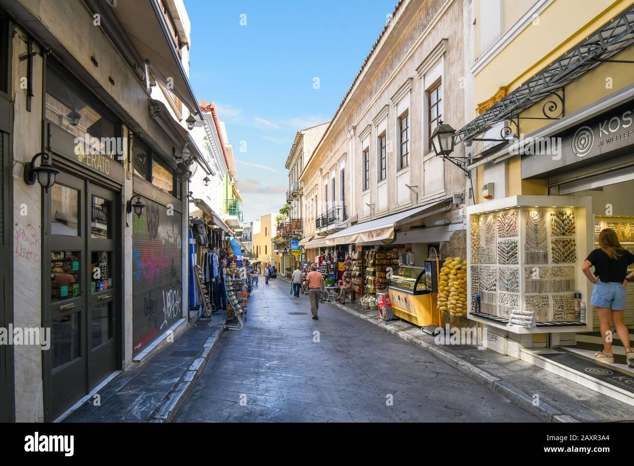 Merchants and workers open their shop businesses early in the morning before the tourist crowds in the Plaka area of Athens, Greece. Stock Photo