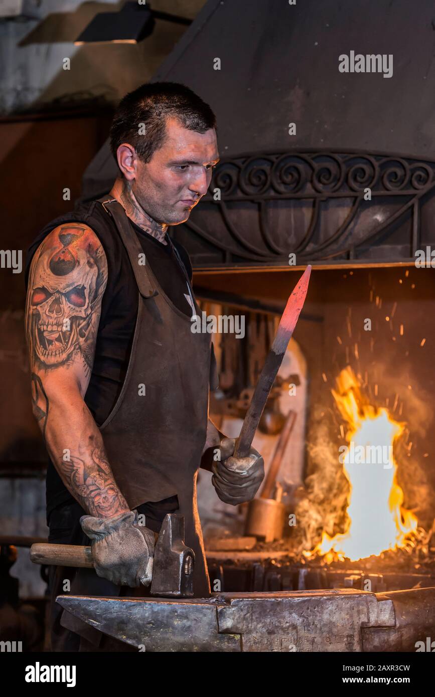 Pernes-les-Fontaines, Vaucluse, Provence-Alpes-Cote d'Azur, France. Blacksmith in the smithy La Forge Stock Photo