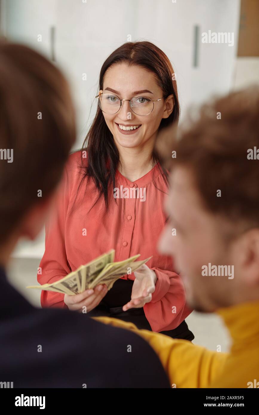 young business woman showing her monetary achievements Stock Photo