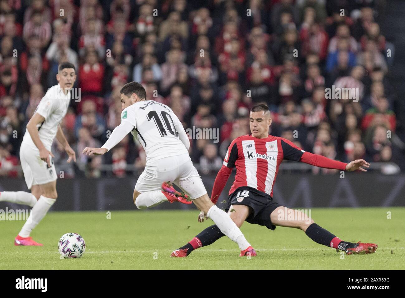 Bilbao, Bizkaia, SPAIN. 12th Feb, 2020. DANI GARCIA (14) tries to win the ball with a dive during the game between Athletic Club and Granada. Athletic Club de Bilbao hosted Granada CF in the going match of the Copa del Rey semifinal at San Mamés stadium.With this victory, Athletic Club faces a good return game at Los CÃrmenes stadium, which will take place on March 4th. Credit: Edu Del Fresno/ZUMA Wire/Alamy Live News Stock Photo