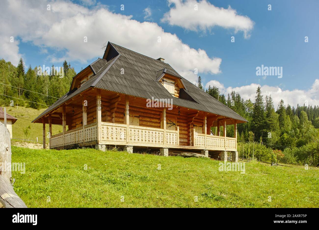 wooden Hutsul-style house in Dzembronya village in Ukrainian Carpathians Stock Photo