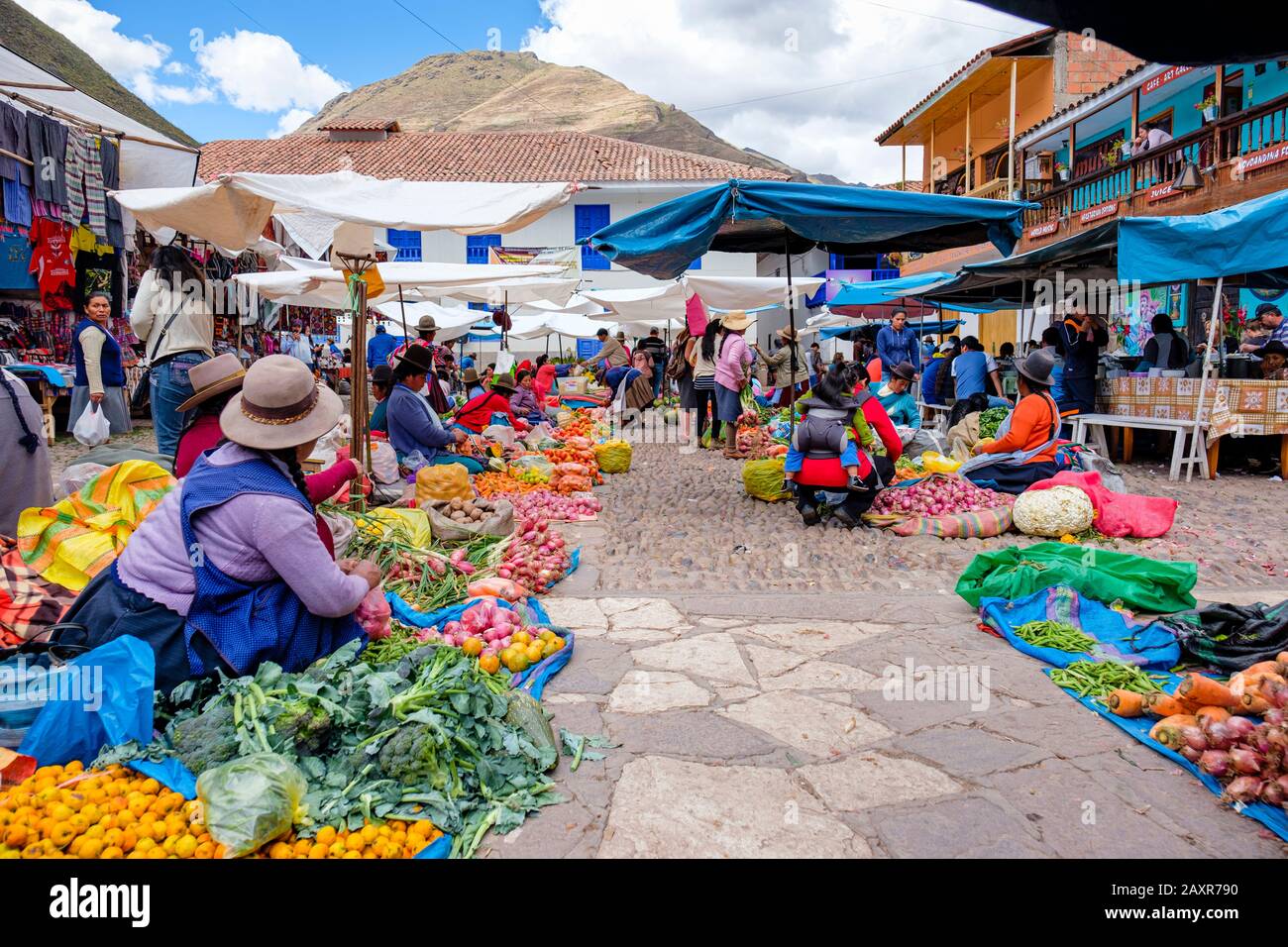 Peru public food market, Sunday market at town of Pisac, vendors, locals, tourists at the city of Pisac market, Peru Sacred Valley Peru Stock Photo