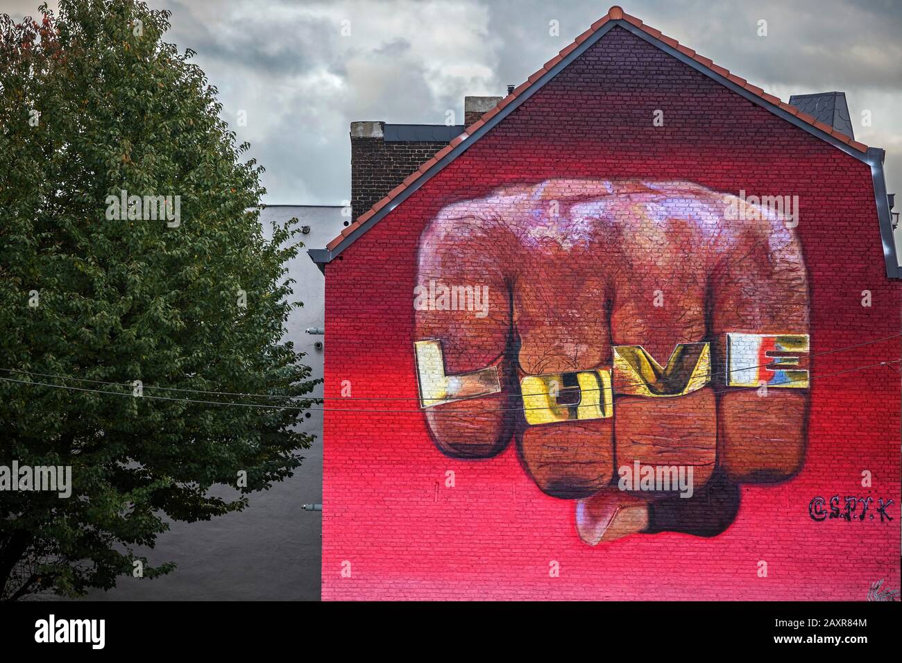 Graffiti on house wall, fist, Love, Liege, Walloon Region, Belgium Stock Photo