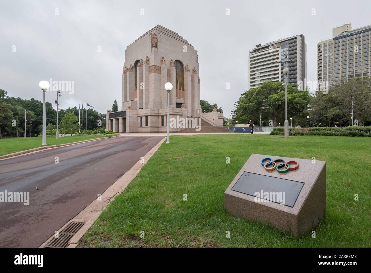 A small memorial plaque near the ANZAC war memorial building in Hyde Park Sydney to commemorate Olympians who lost their lives in armed conflicts Stock Photo