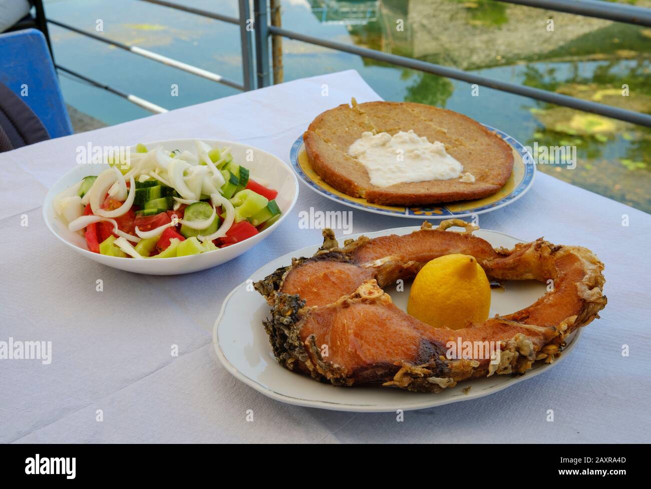 fried carp, fish restaurant at the outlet of Skadar Lake, Shkodra, Shkodër, Qark Shkodra, Albania Stock Photo