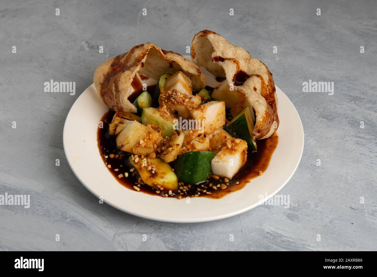 Rojak Buah  traditional Asian fruits mixed with peanut, chilly and sauce Stock Photo