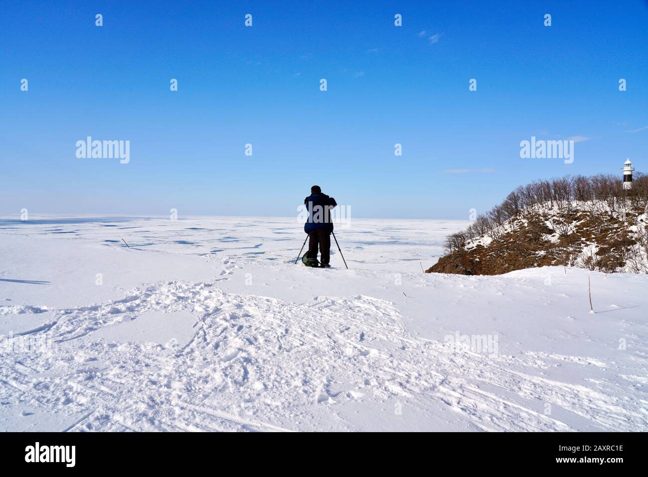 Photographer taking photo of Okhotsk Sea at Utoro Cape, Shiretoko, Hokkaido, Japan Stock Photo