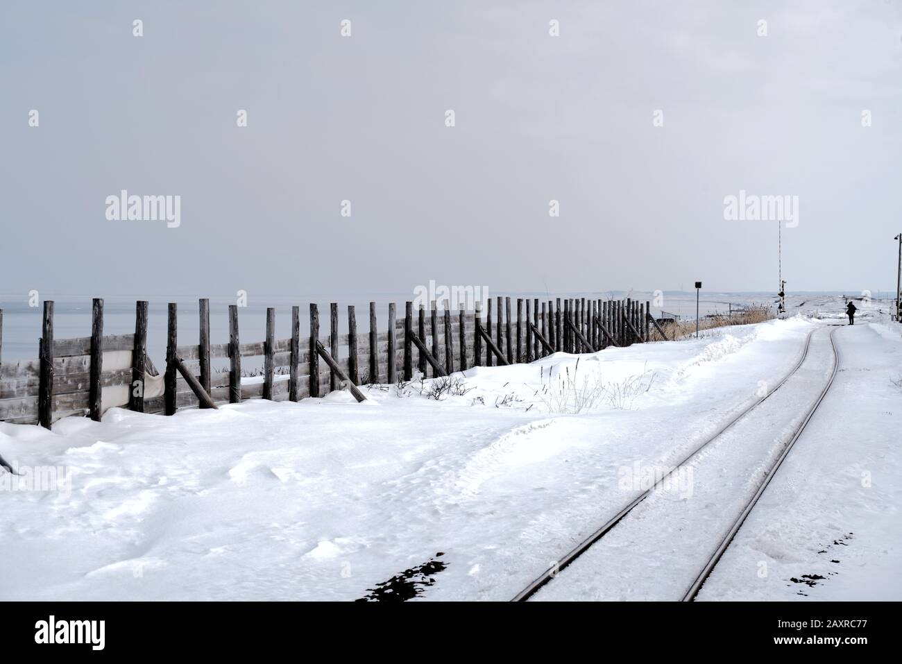 Snow covered railway track at Kitahama station in Abashiri, Hokkaido, Japan Stock Photo