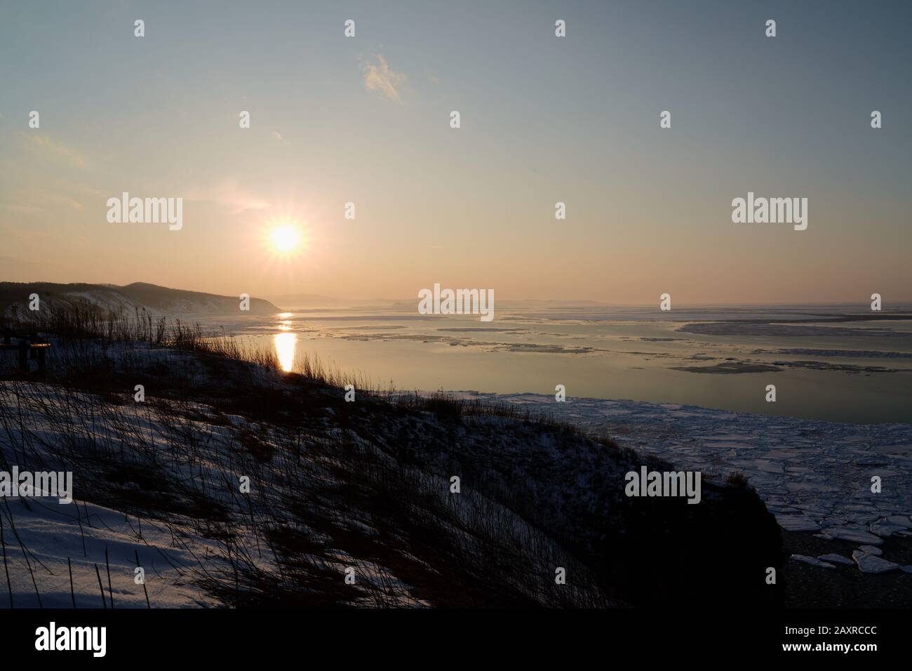 Sunset over Okhotsk sea covered with drift ice at Cape Notoro, Abashiri, Hokkaido, Japan Stock Photo
