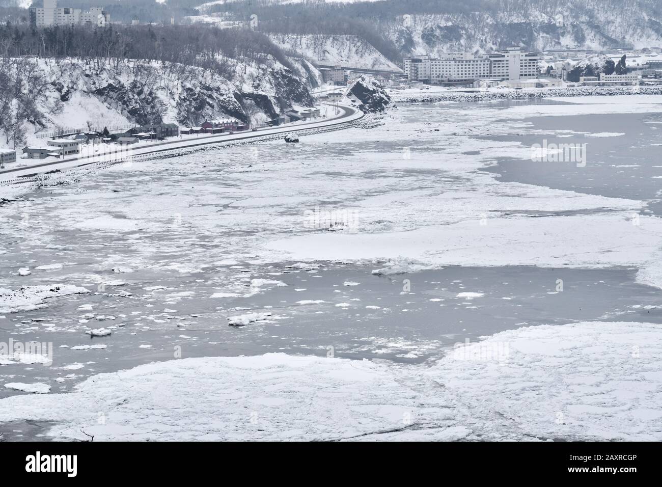View of drift ice covered Okhokst sea at Utoro port in winter, Shiretoko, Hokkaido, Japan Stock Photo