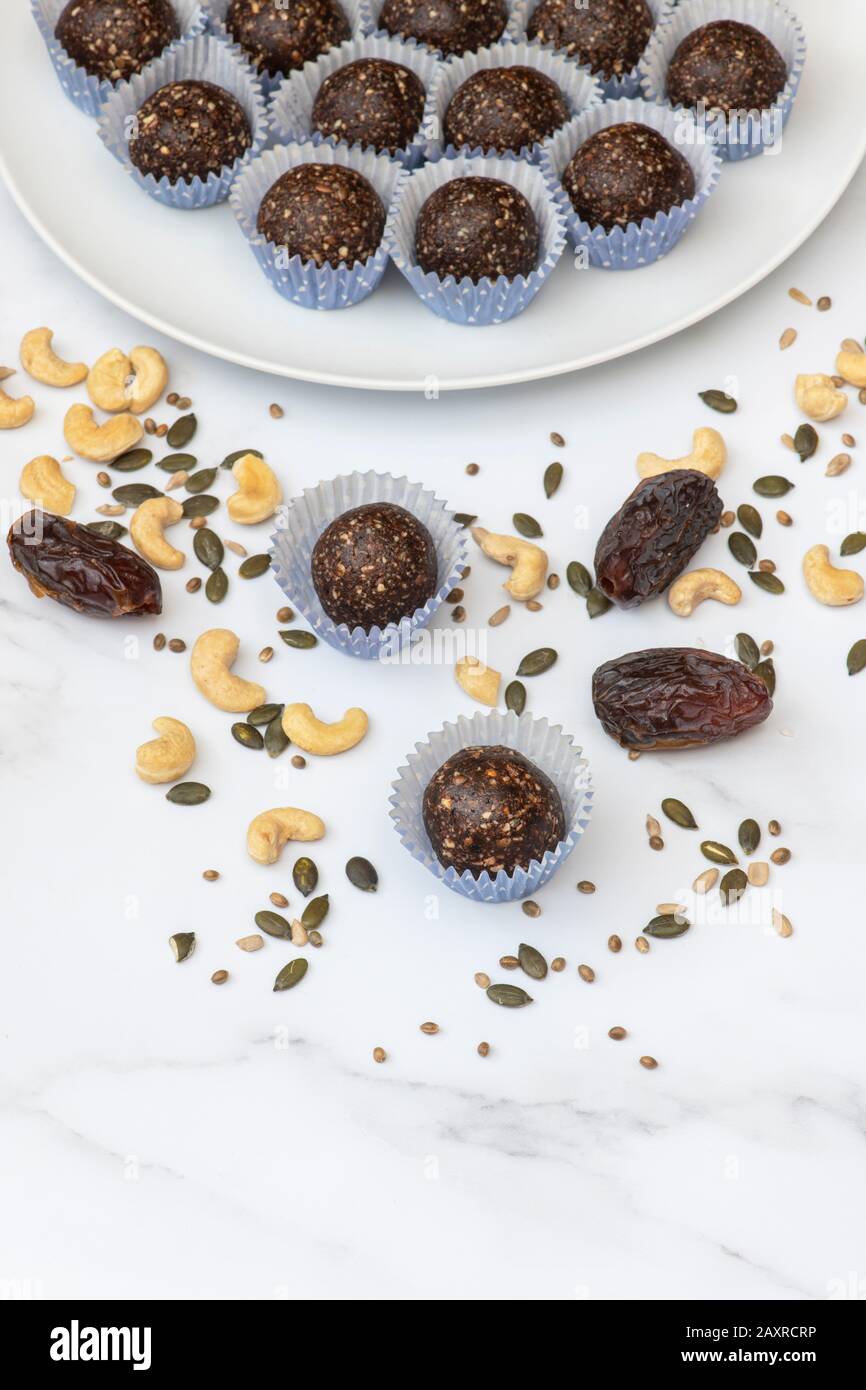 Homemade vegan cacao date seeds and nut energy balls. Made with medjool dates,cashew nuts,hemp