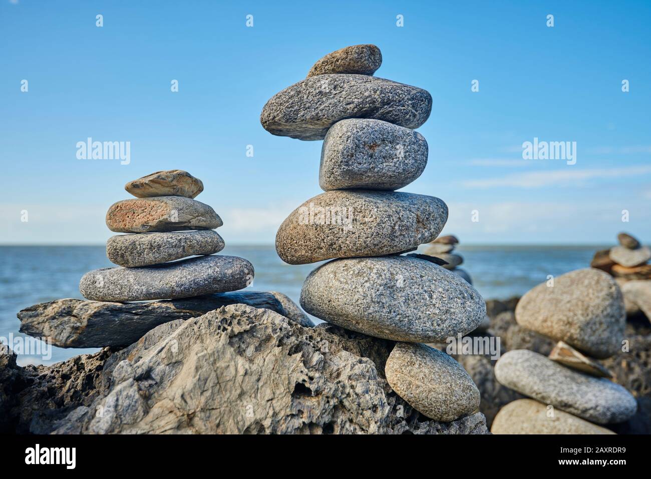 Stones, cairn at the beach, between Cairns and Port Douglas in spring, Queensland, Australia Stock Photo