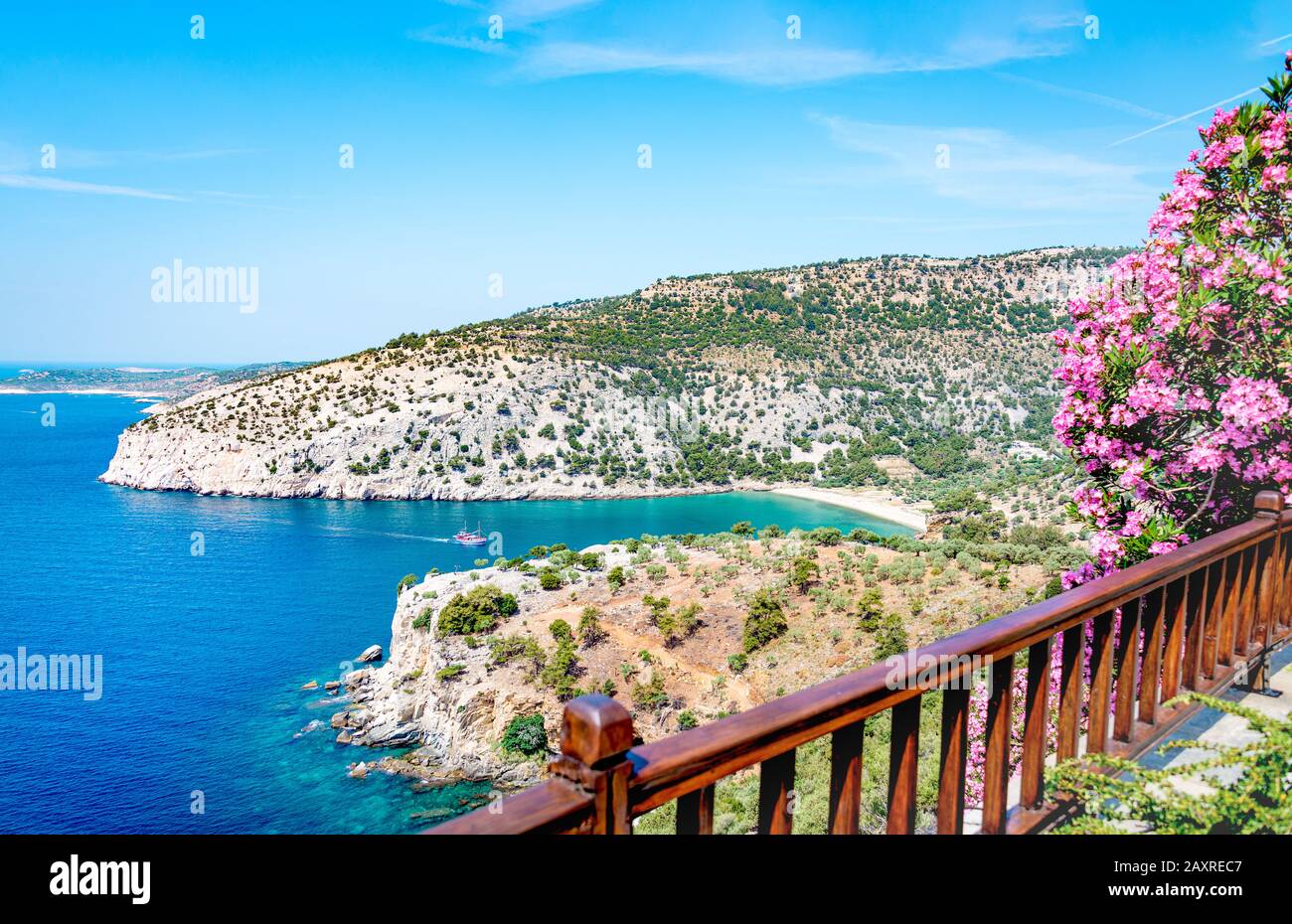 Thassos beautifull coastline seen from a balcony - white sand, exotic flowers and turquoise water. Stock Photo