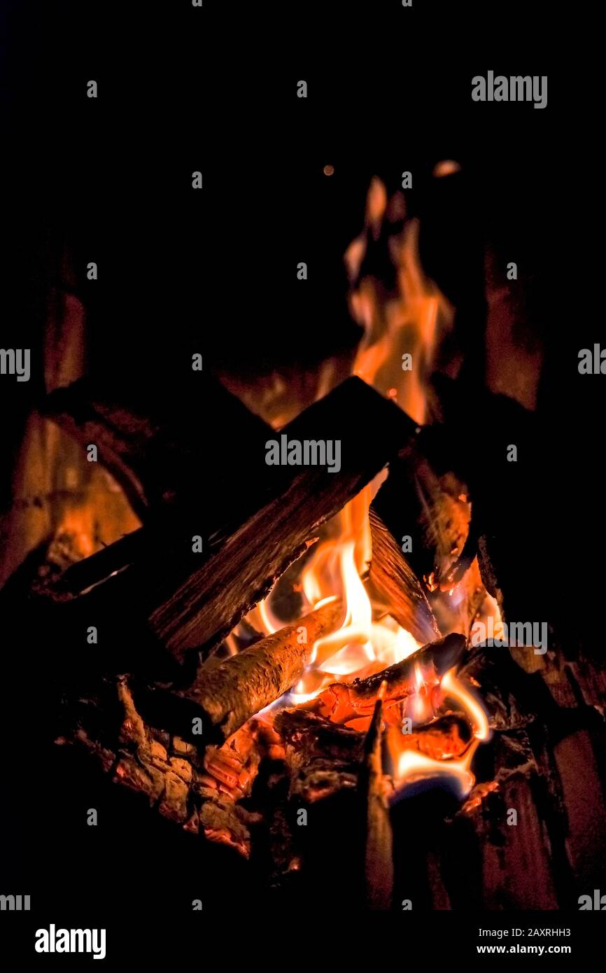 three burning billets in hot stove.Fire flame burning coal and wood in