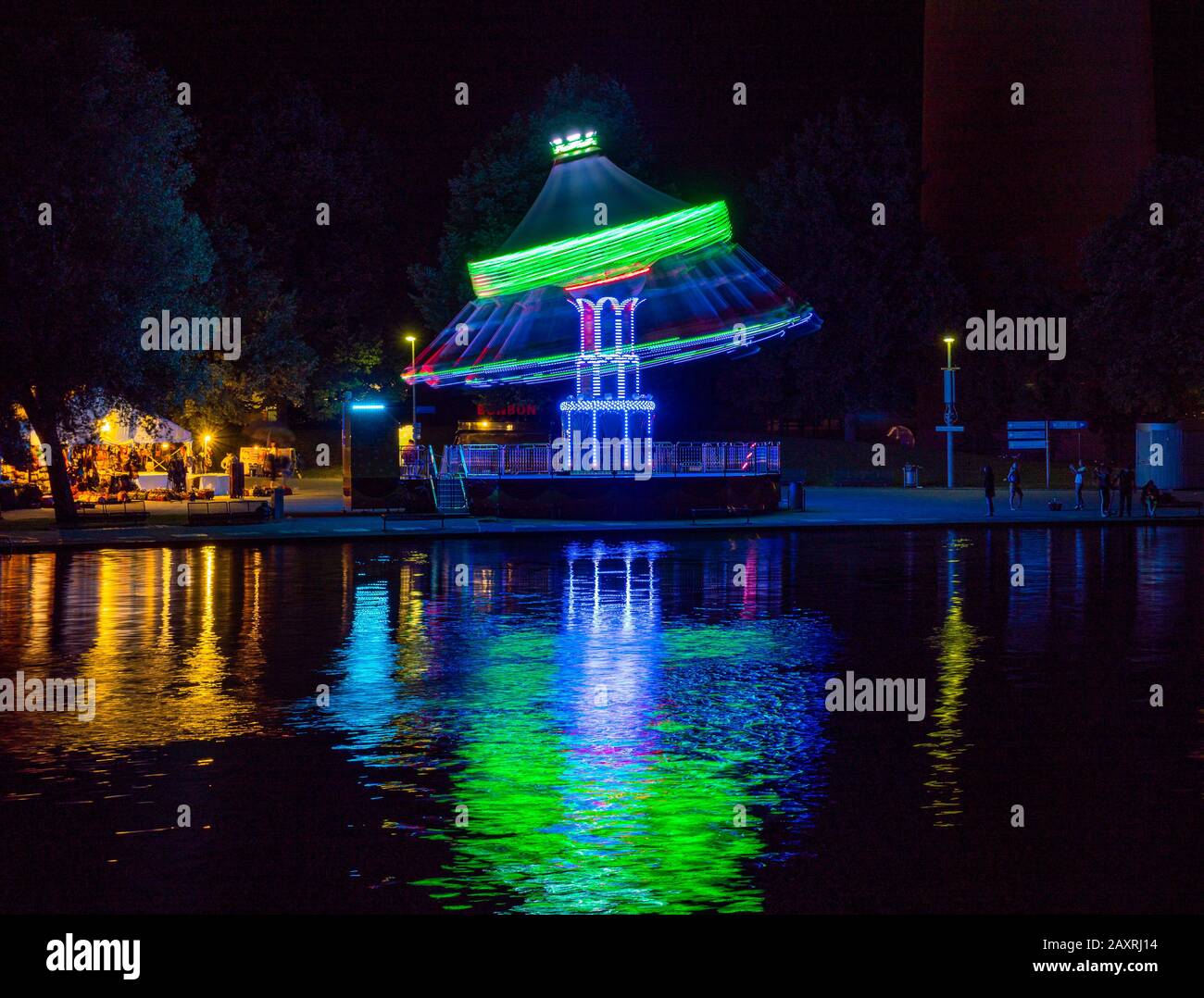 Summer festival in the Olympic Park with Olympic lake at night Munich, Bavaria, Germany, Europe Stock Photo