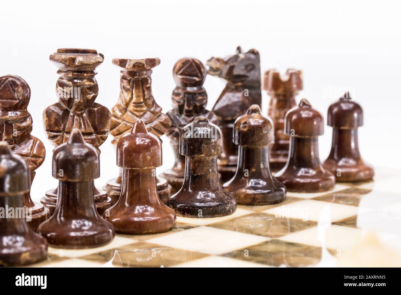 Ancient wooden chess pieces on an old chessboard Stock Photo - Alamy