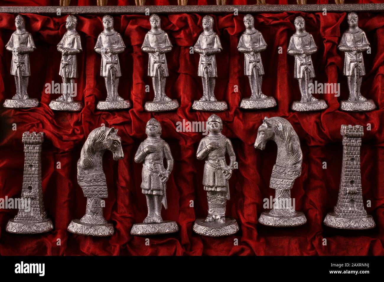 Сhess as an abstract concept. Beautiful antique chess set on marble chess board. Stock Photo