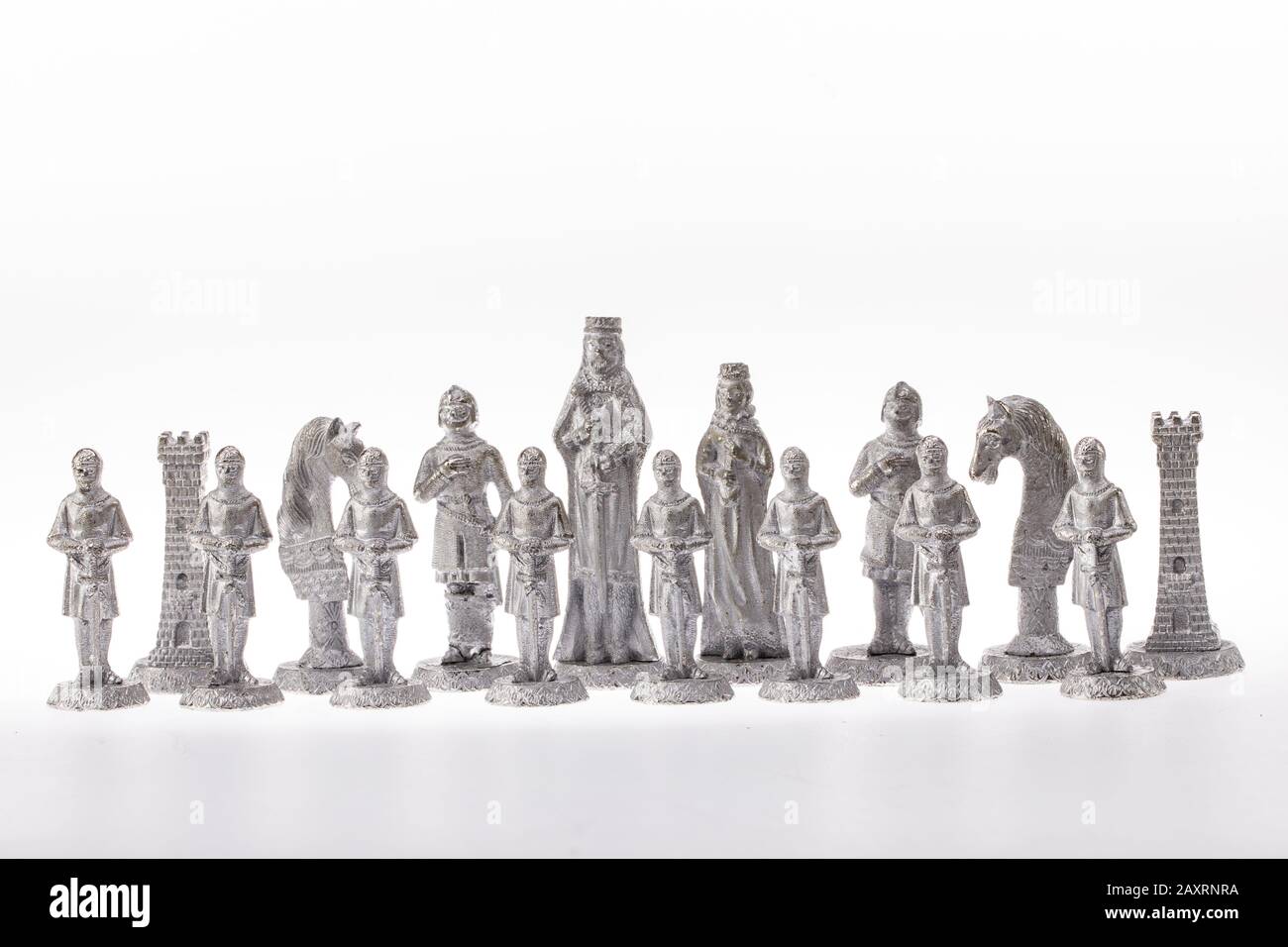 Сhess as an abstract concept. Beautiful antique chess set on white background. Stock Photo