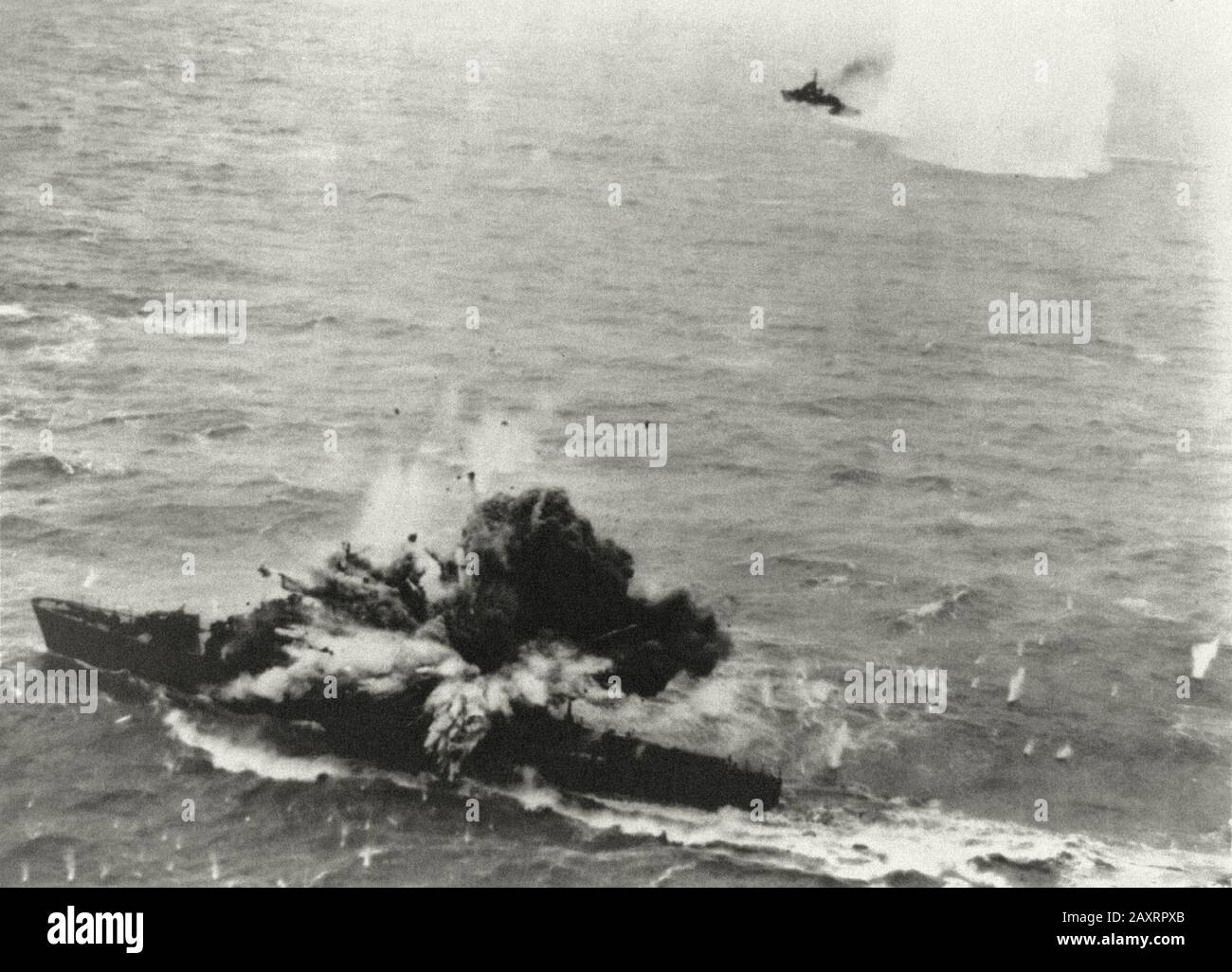 A violent explosion staggers a Japanese destroyer escort after bombing run by North American B-25's of Air Apaches Group off the China Coast, April 6, Stock Photo