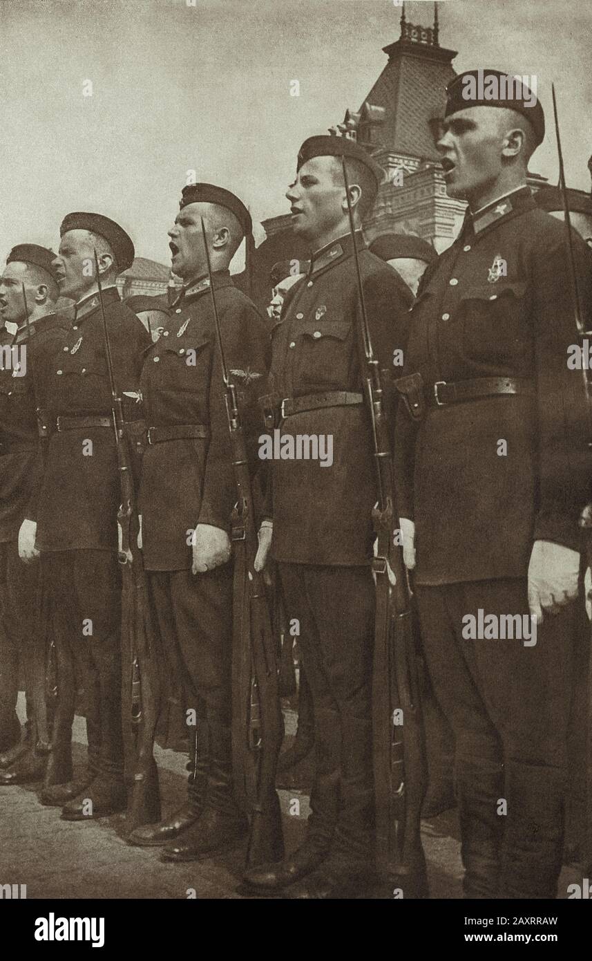 Red Army. From soviet propaganda book of 1937. Soviet soldiers on Red Square in Moscow. Stock Photo