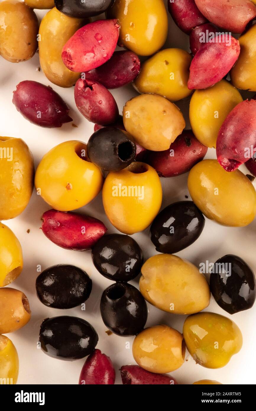 Olives variety background texture. Many black, green and red olives, shot from the top Stock Photo