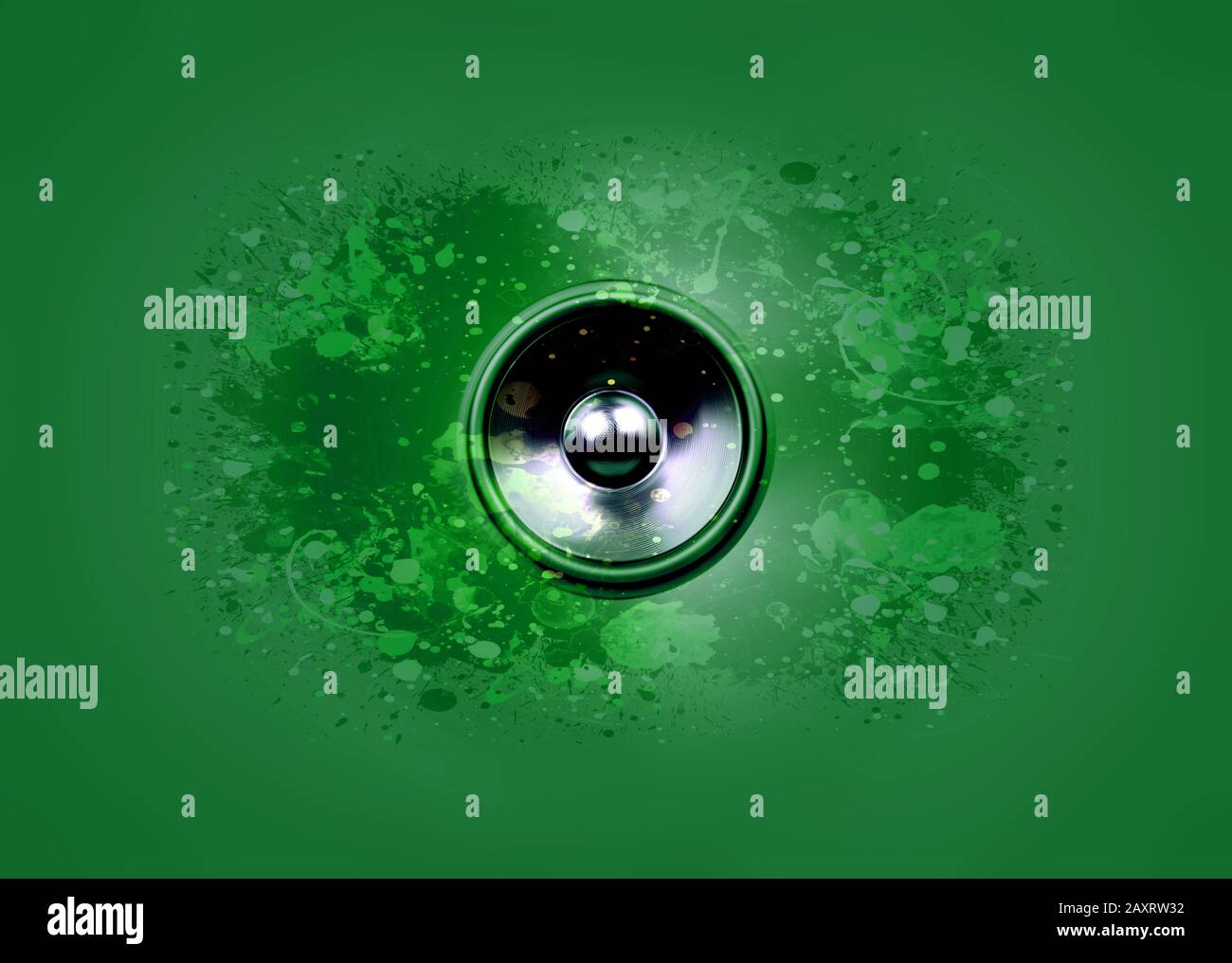 Spinning audio speaker on a green background with paint splatters Stock Photo