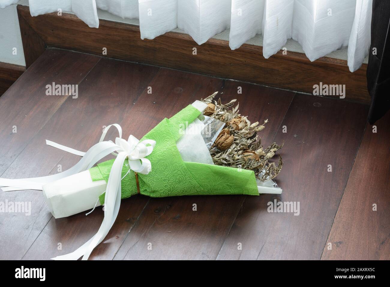 Withered roses on wood floor Stock Photo