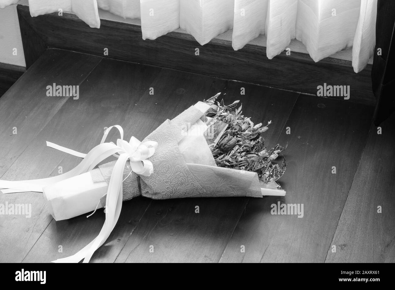 Withered roses on wood floor Stock Photo