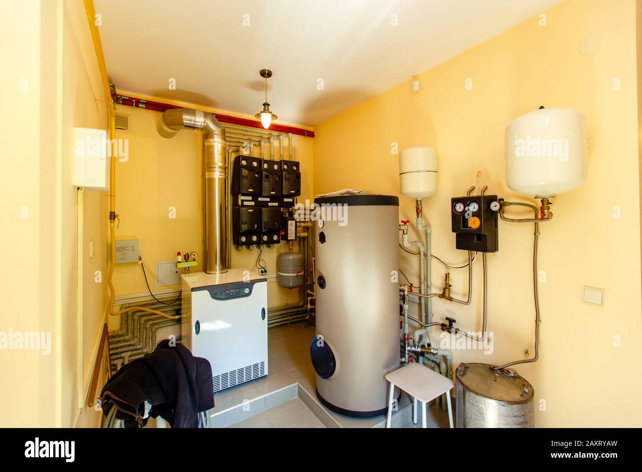 Boiler room and heating system in the cottage. Gas and electric boilers
