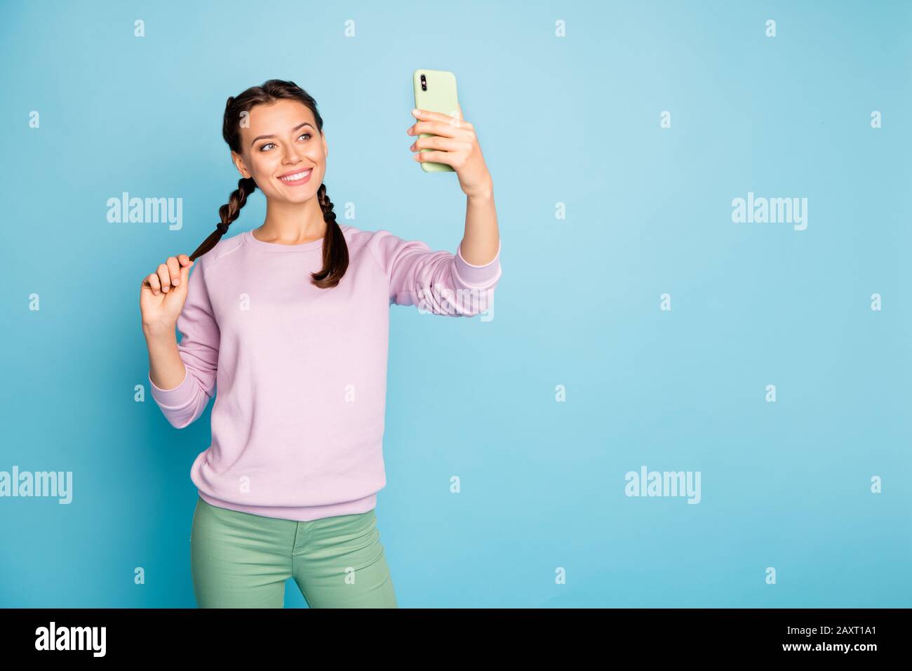 Photo Of Beautiful Lady Hold Telephone Hand Making Funny Selfies Online Blog Translation Video Call Wear Casual Pink Sweater Green Trousers Isolated Stock Photo Alamy