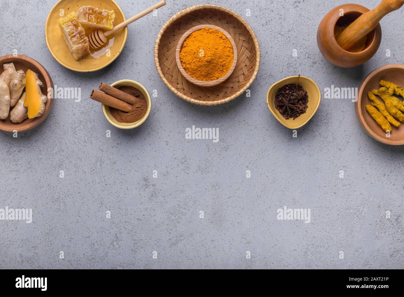 Ground turmeric, curcuma root, cinnamon, ginger, Stock Photo