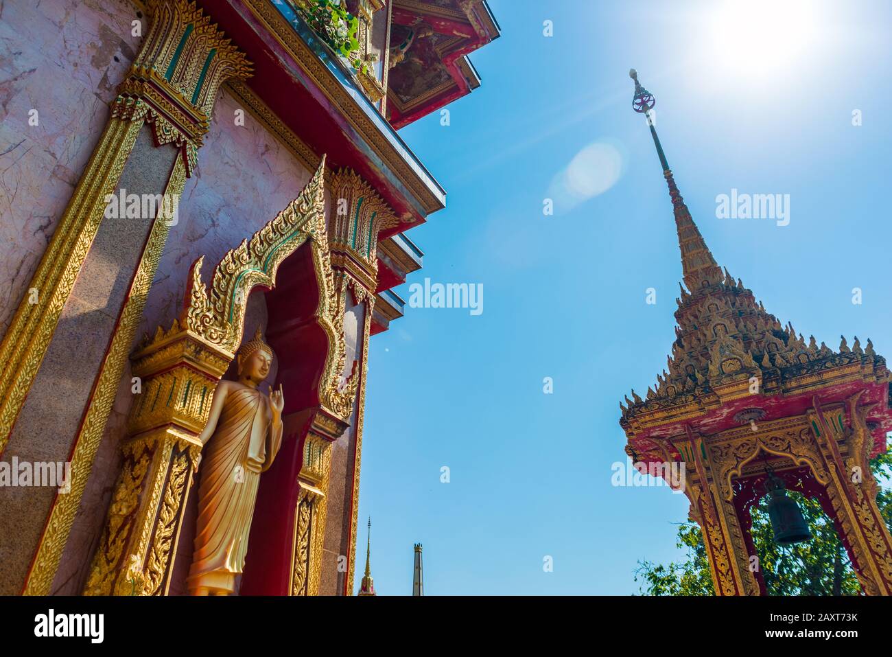 Wat Chalong,Phuket/Thailand-15December2019: view on a pagoda at the historical landmark and Buddhist temple with blue sky and sunny day Stock Photo