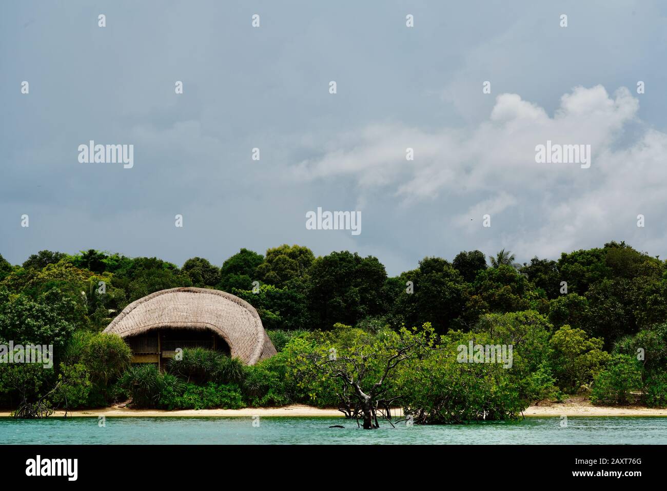 View of bamboo hut and mangrove forest at Cempedak Private Island Resort, Bintan, Indonesia Stock Photo