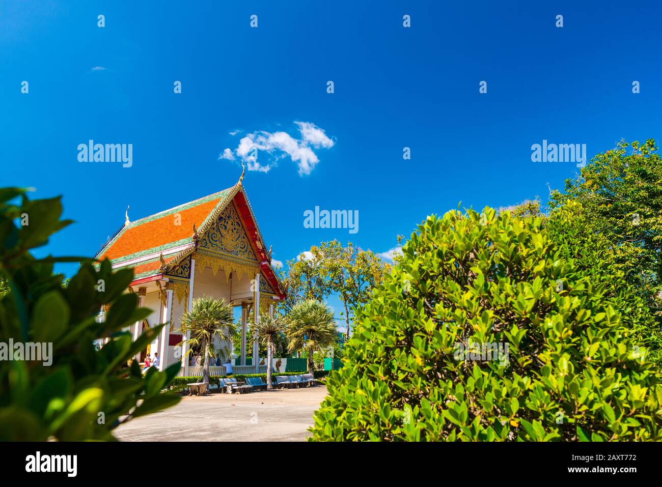 Wat Chalong,Phuket/Thailand-15December2019: view on a pagoda at the historical landmark and Buddhist temple with blue sky and sunny day Stock Photo