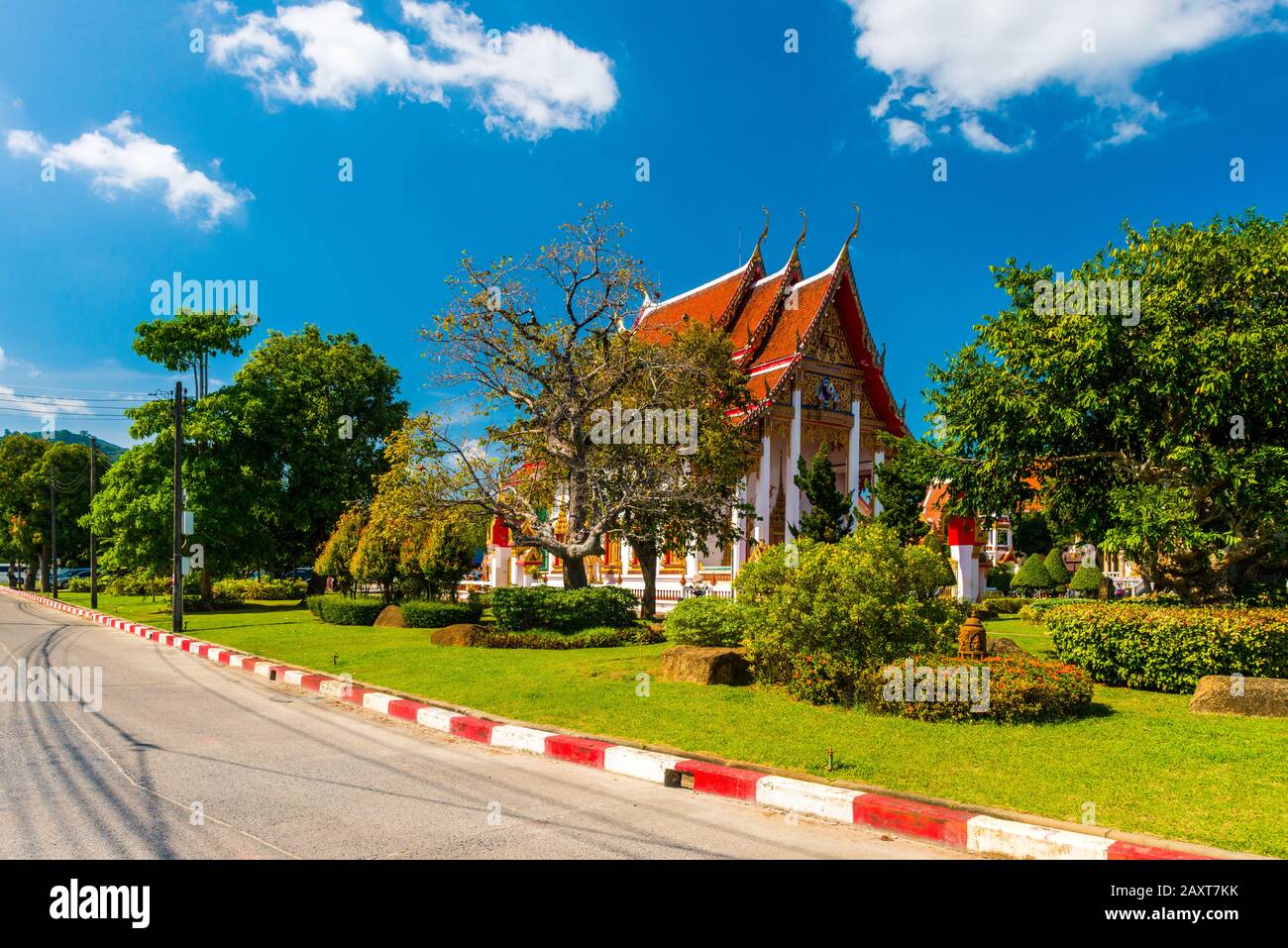 Wat Chalong,Phuket/Thailand-15December2019: view on a pagoda at the historical landmark and Buddhist temple with blue sky and sunny day Stock Photo