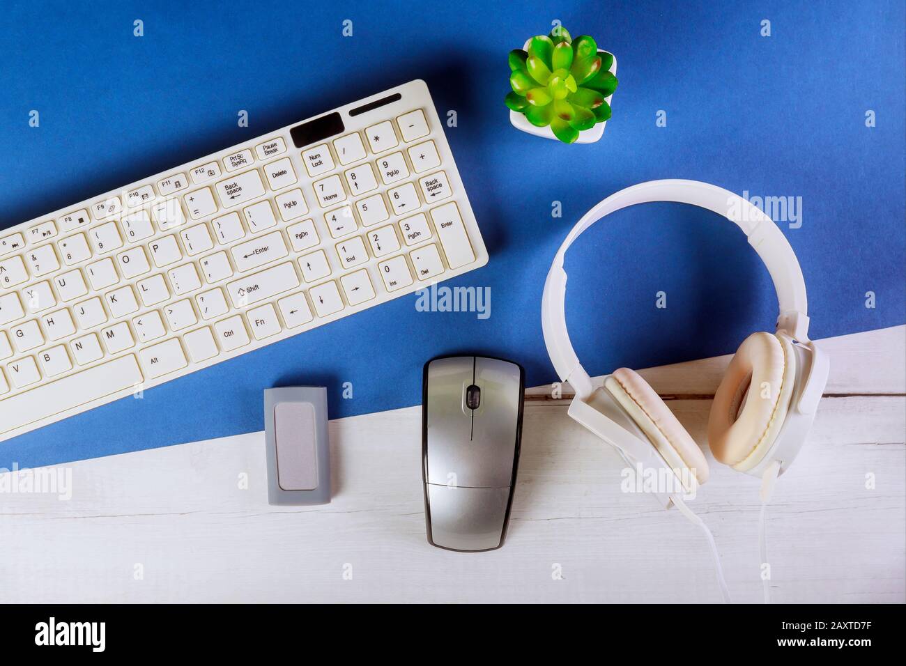 Office desk table noise cancellation headphones in computer keyboards Stock Photo Alamy