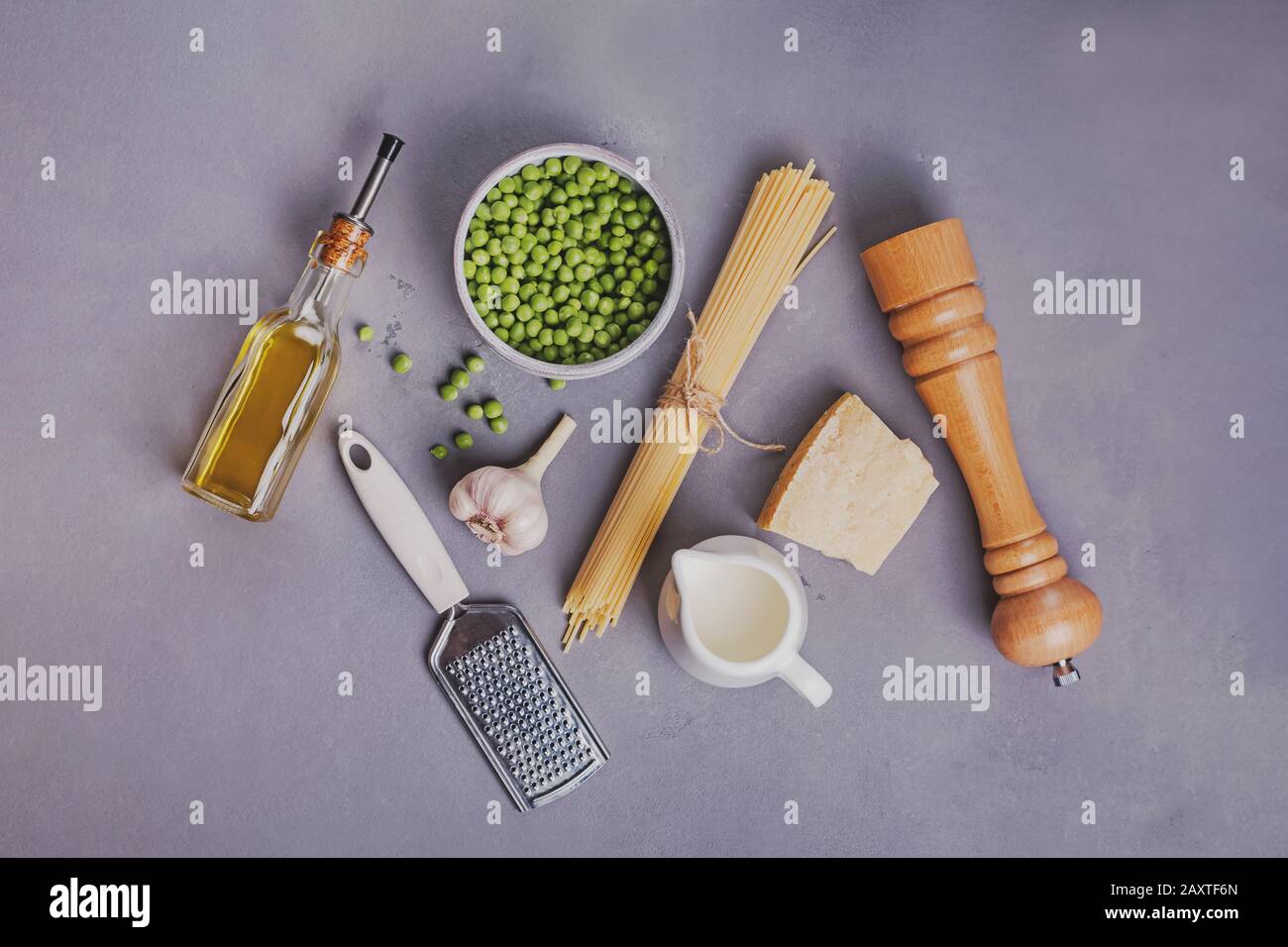 Raw ingredients for making spaghetti with fresh peas Stock Photo
