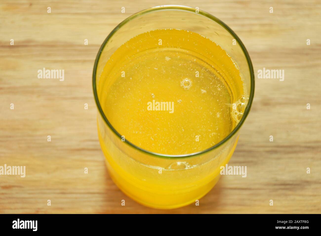 electrolyte orange flavor powder dissolution in freshwater Stock Photo