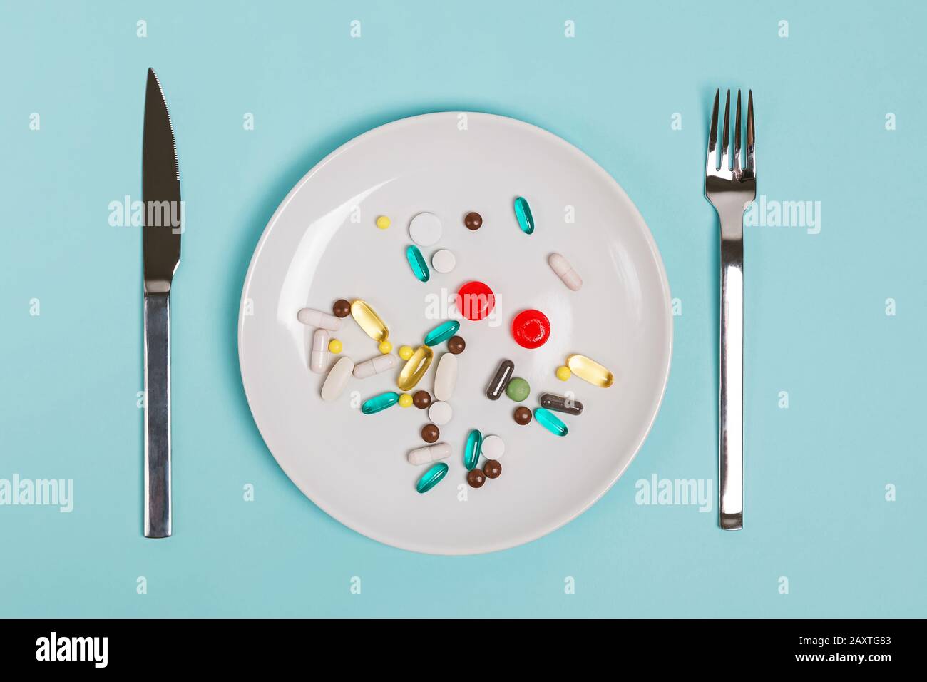 A plate full of capsules and tablets of different shapes and sizes Stock Photo Alamy