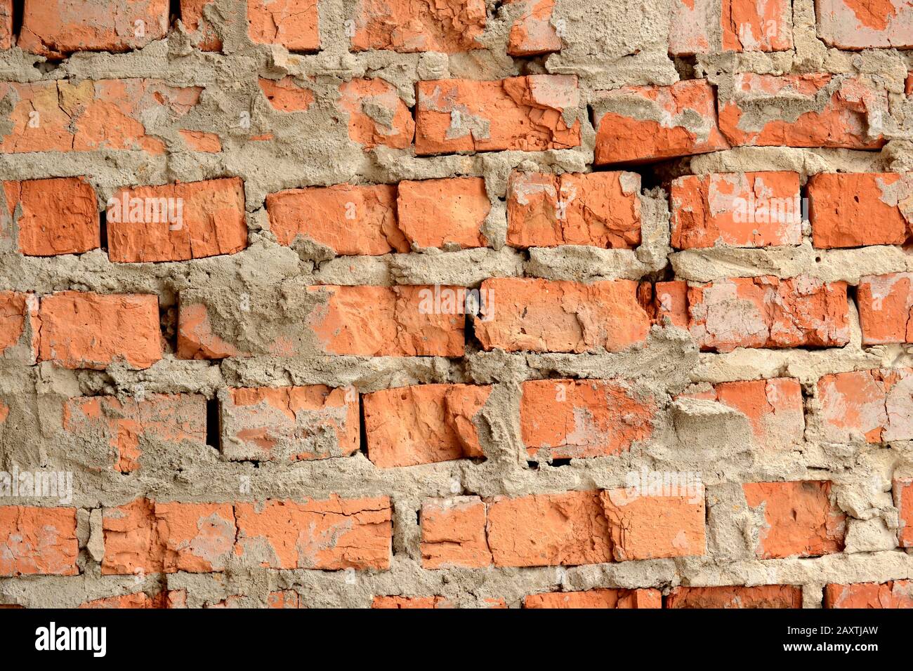 Old horizontal brick wall with slots and cement Stock Photo Alamy